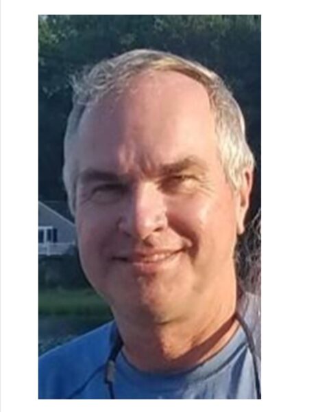 Portrait of middle-aged man in blue shirt